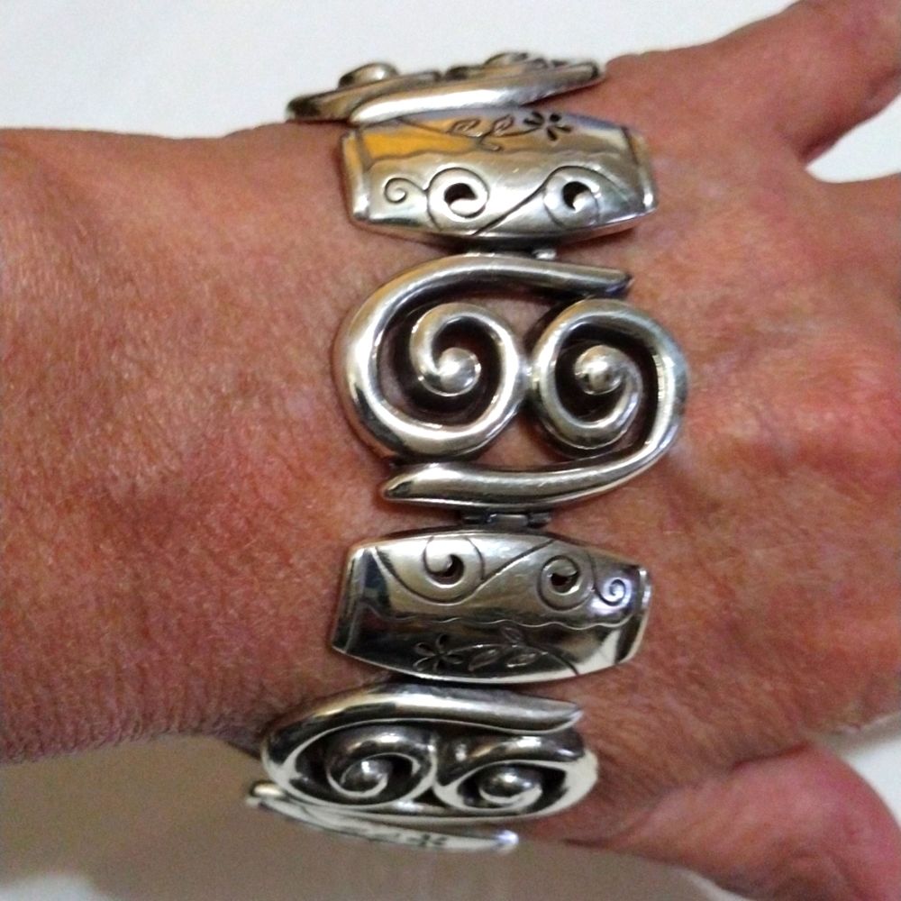 Brighton linked silver medallions cuff bracelet.